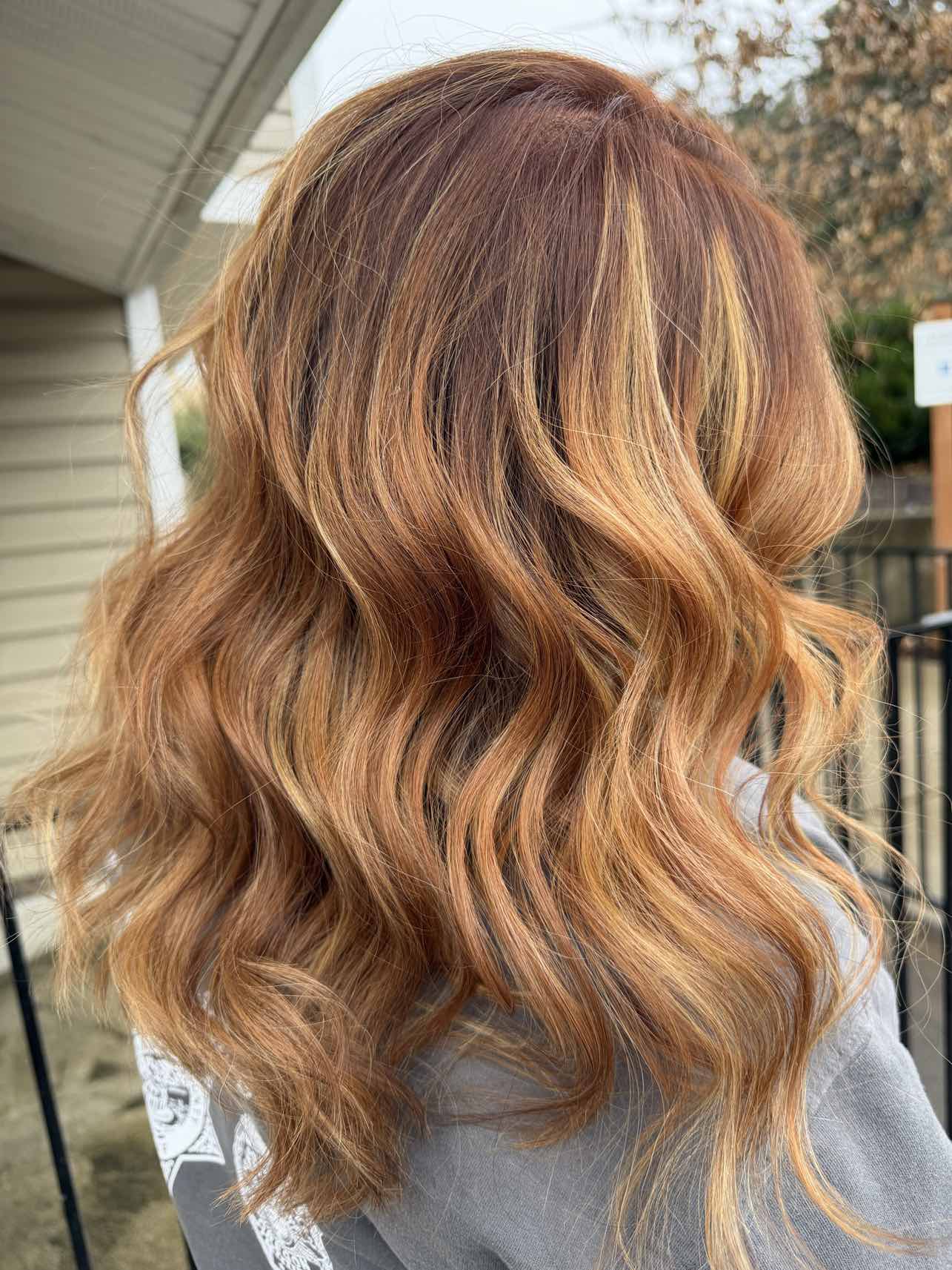 Copper and strawberry blonde with soft highlights