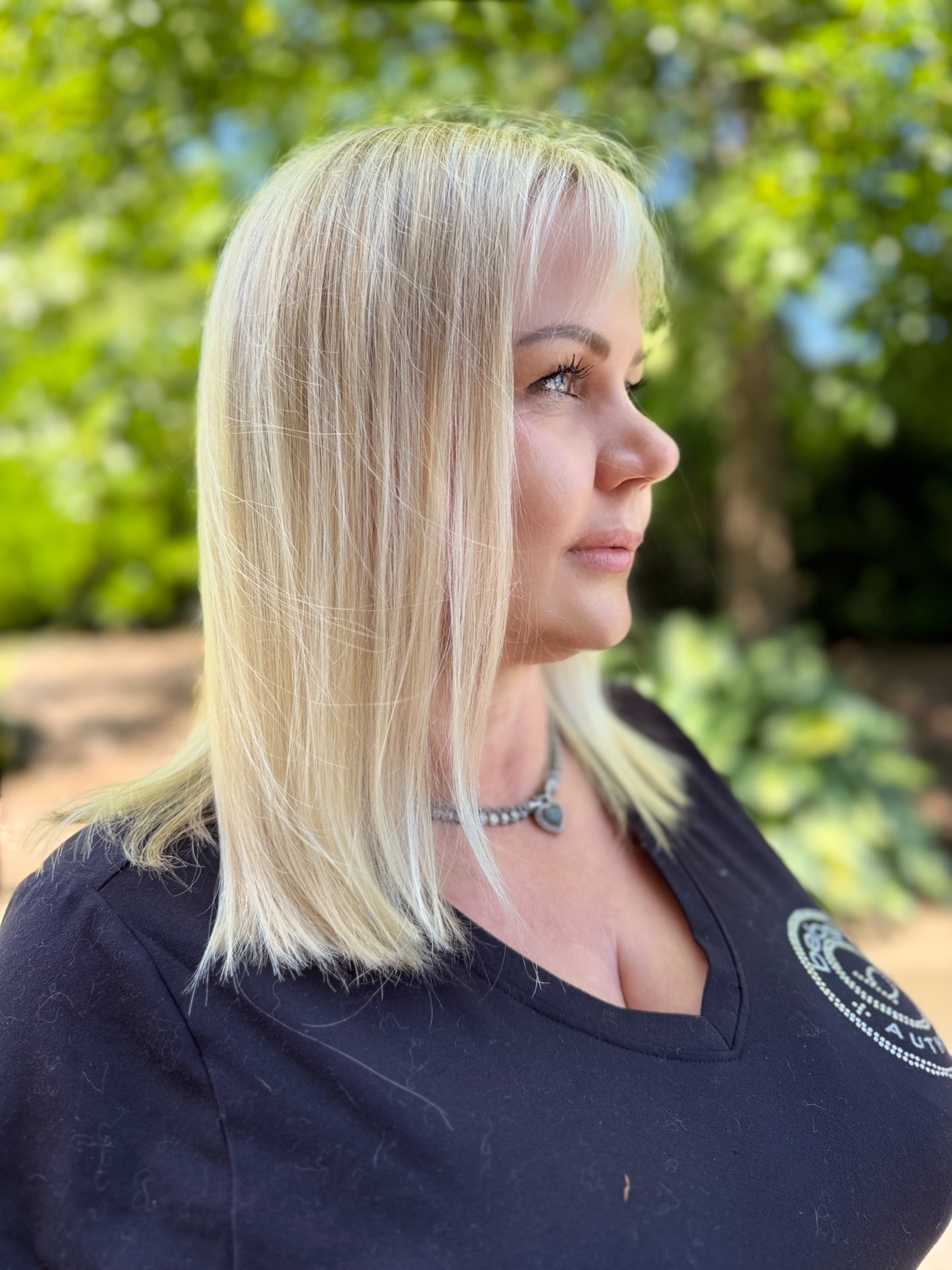 Sleek platinum blonde lob with bangs